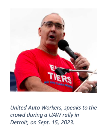 UAW speaks to crowd during a rally in Detroit